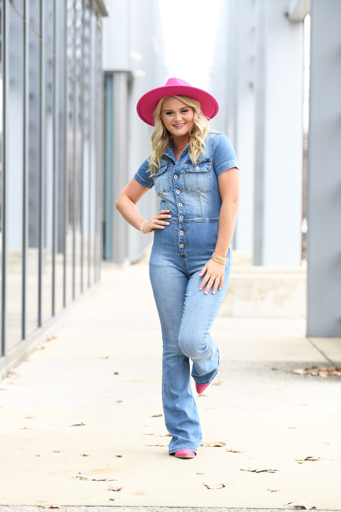 Midtown Memphis high school senior session girl in jeans jumsuit with pink hat near Ballet Memphis