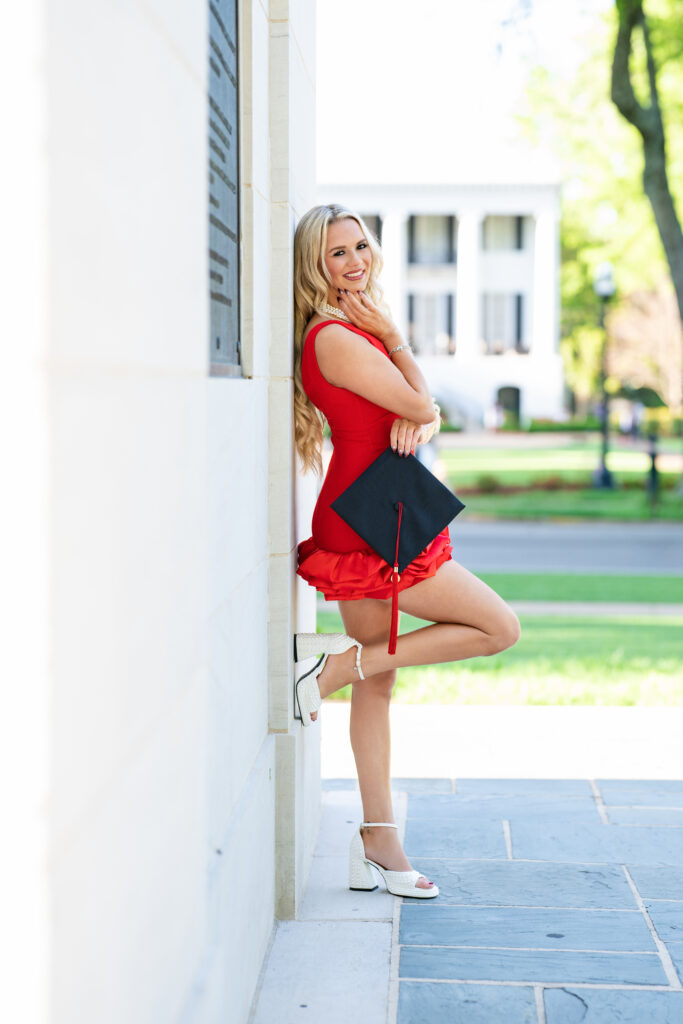 Bama Grad posing at Denny chimes for her grad photos with Chris Landau Photography