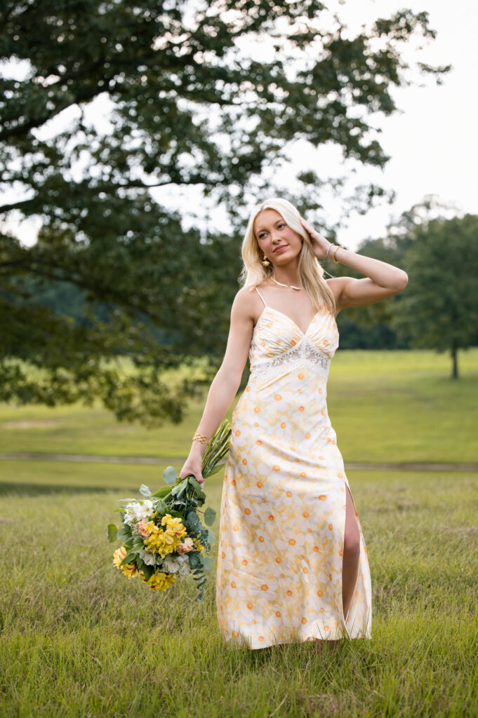 High school senior girl with flowers for her senior photoshoot