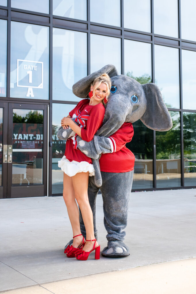 Big Al hugs a Bama Grad during her photoshoot with Chris Landau Photography