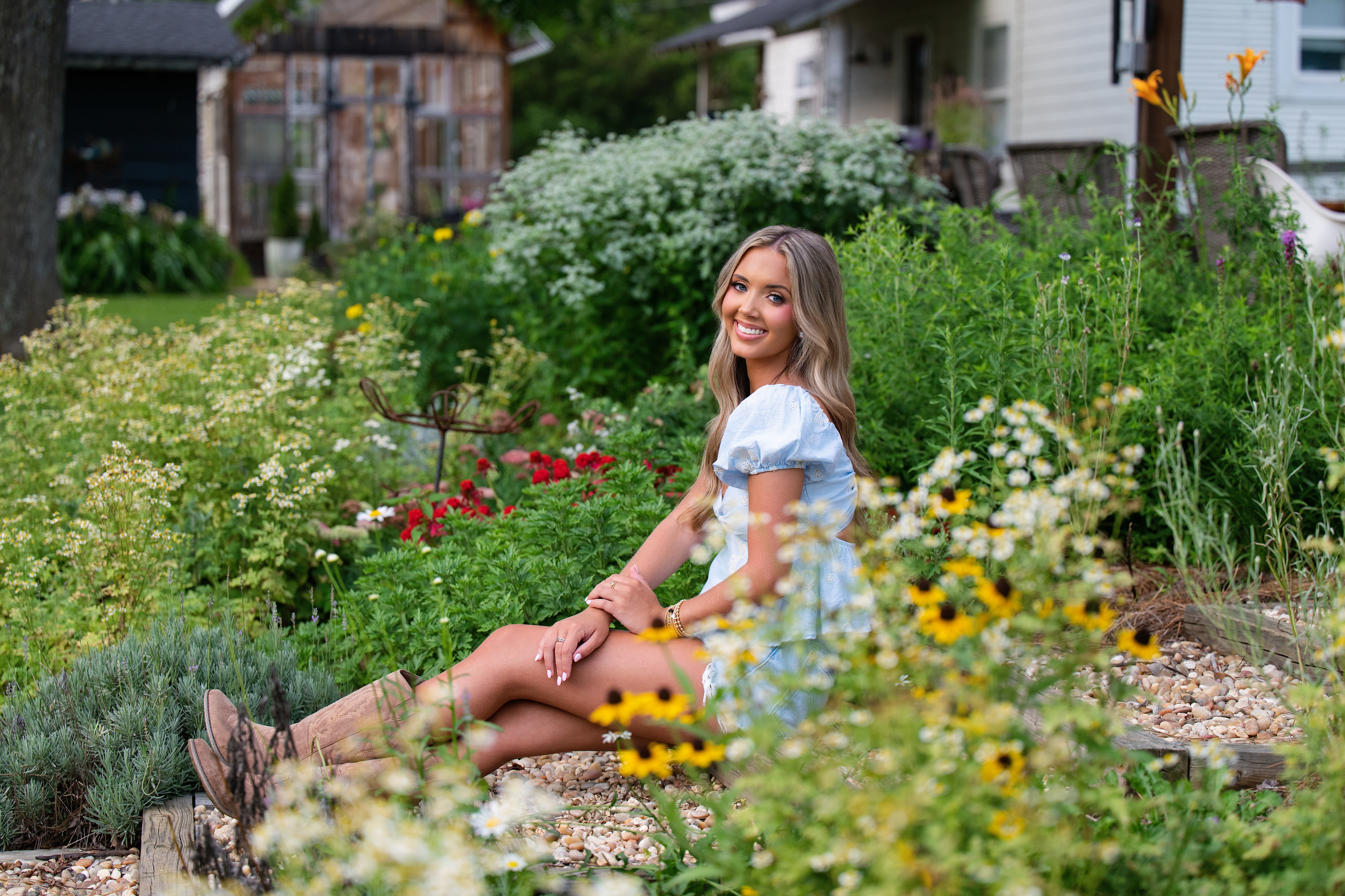 country senior pictures at farm with flowers