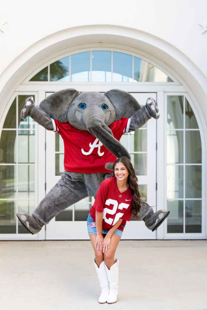 Big Al jumps up behind a bama grad at the Randall Welcome Center